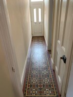 Nice entrance hallway with a contemporary mosaic floor design 