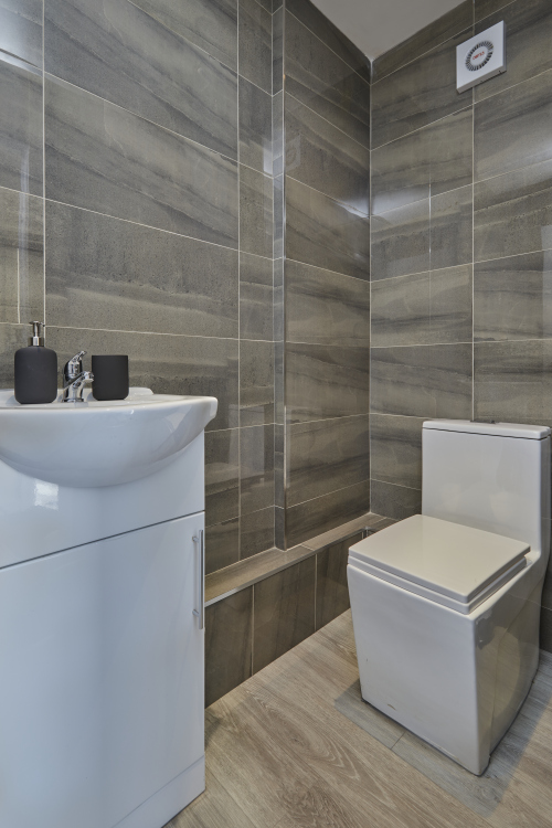 A fresh, well-maintained bathroom with essential amenities provided.