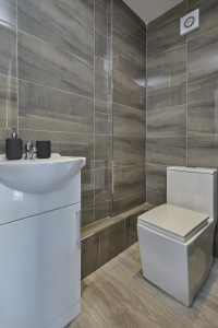 A fresh, well-maintained bathroom with essential amenities provided.