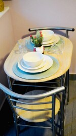 Dining area for 8 guests with brand new dining table chair set and crockery sets
