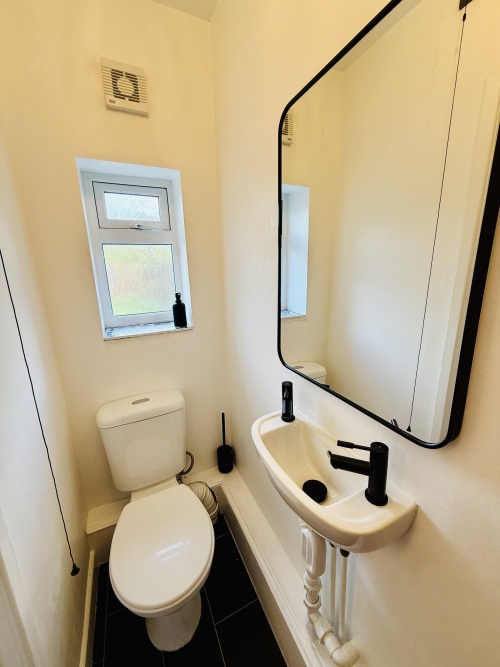 Separate downstairs cloakroom with washer dryer