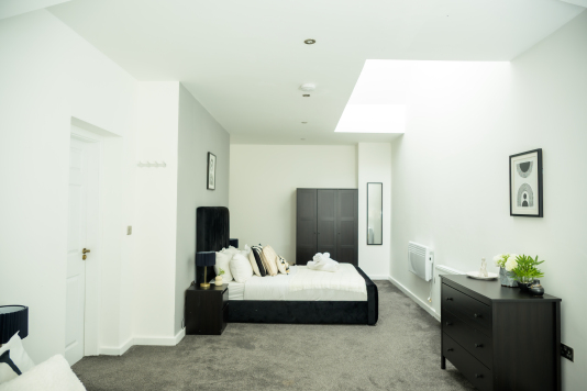 Relax and unwind in this cosy double bedroom, designed for a peaceful night’s sleep.