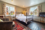Bedroom 1 showing dual aspect and bed