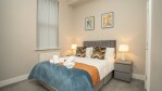 Comfortable, fresh, modern bedroom, with hotel style linens and towels. 