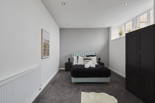 A comfortable double bedroom offering the perfect blend of comfort and simplicity.