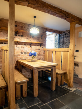 Cozy sitting area in the bar with characterful barn features