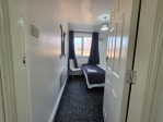 The second bedroom offers a comfortable double bed, a spacious wardrobe for unpacking, and fresh towels provided for your convenience. Whether you're here for a work contract or a weekend break, this room has everything you need for a restful stay.