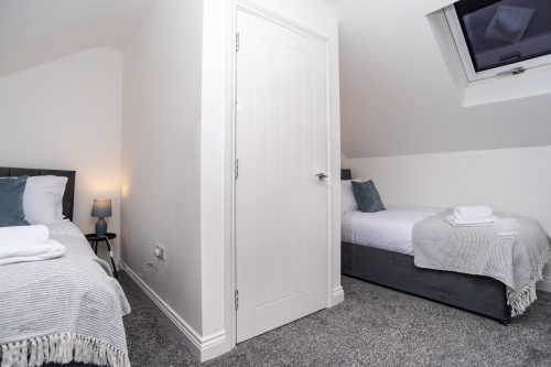 Two Single Beds with Privacy Wall & Blackout Blinds