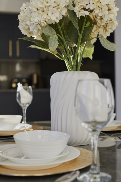 Well-appointed kitchen with essential appliances and ample workspace.