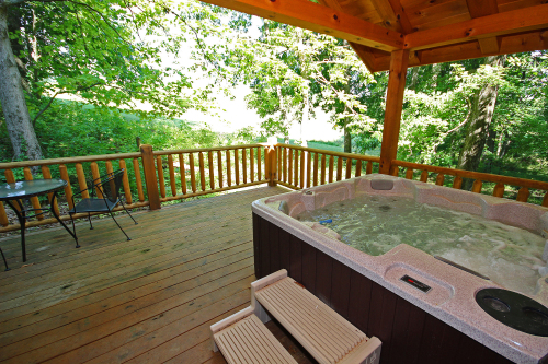 Hot Tub on back deck, with trees and meadow beyond