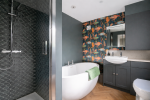 Relax and unwind in this beautifully updated spa-style bath.