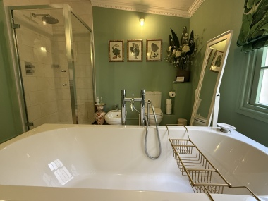 family bathroom with freestanding bath and walk in shower, bidet , toilet and double sinks