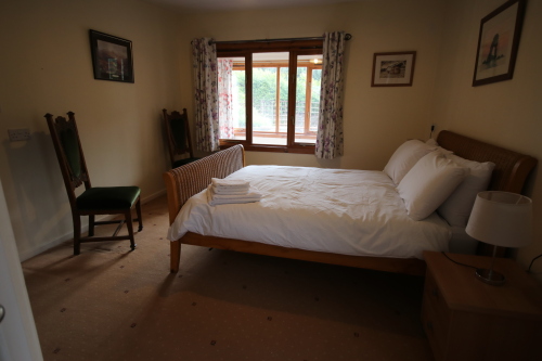 Main bedroom looking to conservatory and rear garden