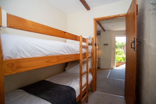 Perfect for families, the bunk bedroom offers a practical and comfortable space for children or additional guests during your North Devon getaway.