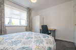 Bedroom 2 with work table and chair