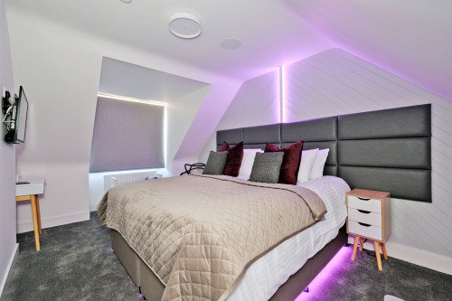 Top Right bedroom, each with Smart TVs, integrated LED lighting for reading and night mode tred lighting