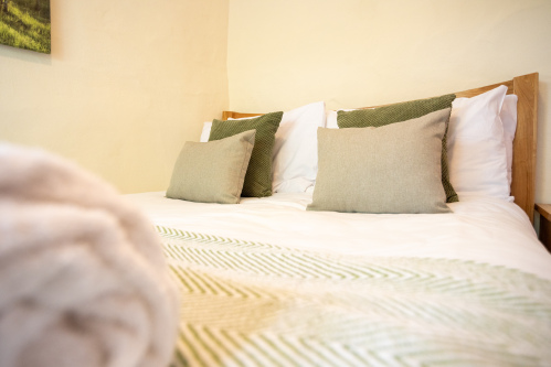 Light and inviting double bedroom offering a peaceful retreat after days spent exploring North Devon's beaches and coastal paths.