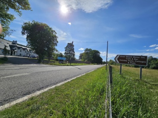 Signs on the main road showing entrance to the property
