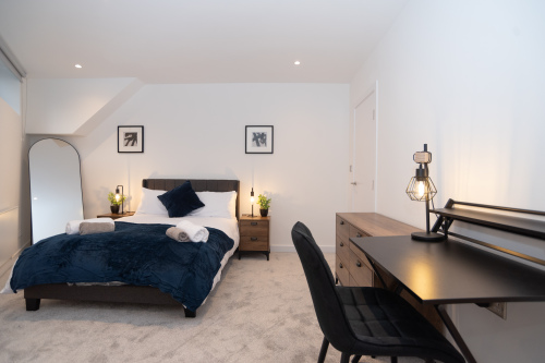 A comfortable third double bedroom with super-comfy beds and mattresses, hotel-quality linen and towels, wardrobe with hangers, and complimentary shower gel, shampoo, conditioner, tea, coffee and sugar - offering the perfect home-from-home stay.