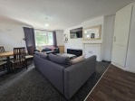 Whether you're here for a work contract or a weekend escape, this open plan lounge has everything you need. Cook in the kitchenette, dine at the table for 4, stream your favourites on the 55" Smart TV, and make use of the sofa bed for extra guests. It's all about comfort and convenience.