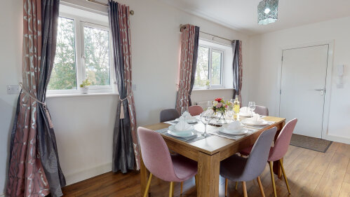 SRK Serviced Accommodation - Table and six chairs to relax and dine all together