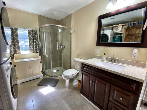Main Bathroom with Shower and washer/dryer. 