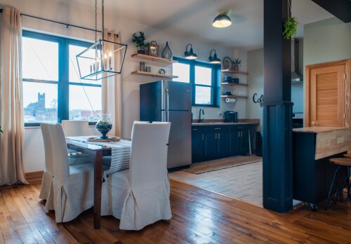 Dining room and kitchen. Full size fridge, and electric stove/ oven