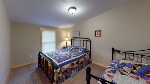 Bedroom 4 comfortably accommodates 2-4  guests in its Queen and Twin/Trundle bed