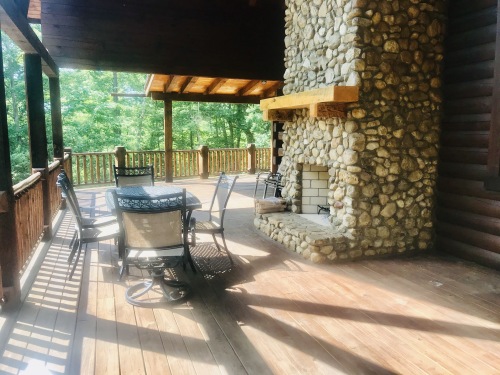 Outside fireplace on spacious covered deck