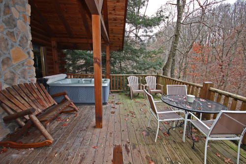 Back Deck, with Rocker Bench, Hot Tub, Adirondack Chairs and Outdoor Dining Table