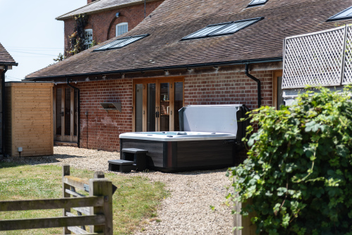 Private spa garden with hot tub, sauna & patio doors opening straight into your secluded outdoor space