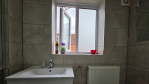 Sparkling clean and beautifully designed. This family bathroom offers a bath/shower combo in a fresh, modern space.