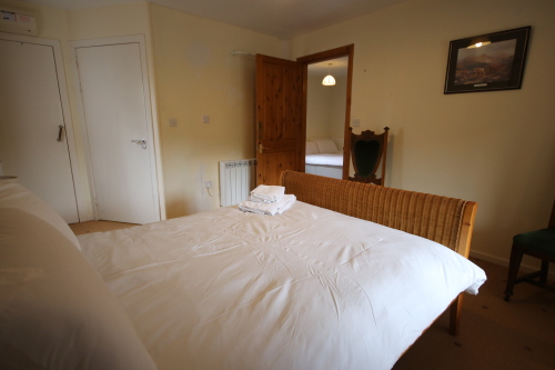 Main Bedroom, from left, cupboard door, ensuite door, lounge door
