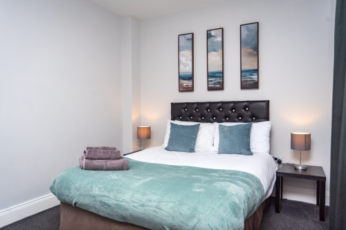 Calm, welcoming bedroom designed for restful nights, complete with soft bedding and a relaxing atmosphere.