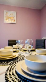 Dining area for 8 guests with crockery sets