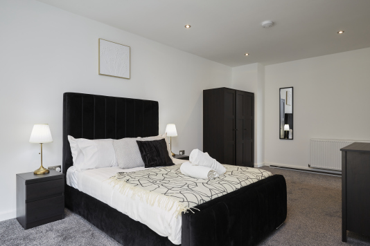 Relax and unwind in this cosy double bedroom, designed for a peaceful night’s sleep.