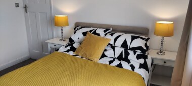 Beautiful double bedroom with feature fireplace and double wardrobe.