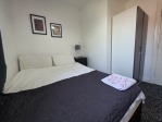Perfect for solo travellers, couples, or colleagues, the second bedroom is a welcoming space with a double bed, generous storage, and fresh towels. It's the ideal retreat after a busy day on site or exploring the city.