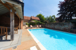 View of pool towards house