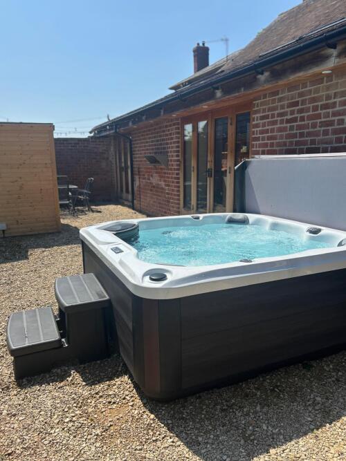 Hot tub set to temperature, and ready on arrival — freshly cleaned and perfect for a relaxing getaway
