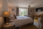 Ivory bedroom with garden view