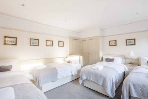 Bedroom 3: 2 Super Kings or 4 singles beds. Each bed has pocket sprung mattresses which are dressed in Egyptian cotton linen. Perfect for families or friends
