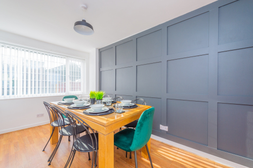 Sit down together and eat and drink in our lovely panelled dining room