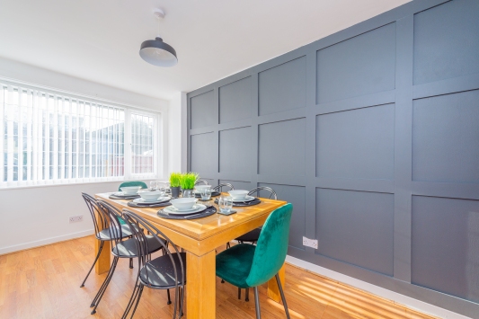 Sit down together and eat and drink in our lovely panelled dining room