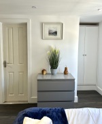 Beautiful large bedroom with stunning natural light, smart TV, desk with ergonomic chair, on-suite bathroom with walk in shower, lamp, built in wardrobe, chest of draws and everything else you need for a perfect stay!