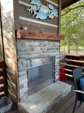 Cozy up by the outdoor fireplace after some cold day catfish fishing at Moby Dick's Private Pond. 