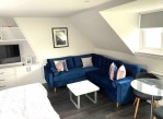 Studio apt lounge area which turns into a double bed. Additional covers and pillows provided by us.  