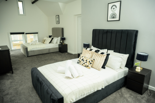 Your private retreat: a stylish double bedroom with a calm, welcoming feel.