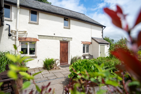 Character-Filled Stone Barn - Original stone walls and traditional slate roof, the heart of Old Mill Cottages estate, perfect for groups who want real Devon character and countryside soul.
