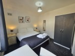 Ideal for solo travellers or couples, this bedroom combines comfort with practicality. The double bed, wardrobe, and workstation make it a versatile space that adapts to your needs – whether you're here for business or pleasure.